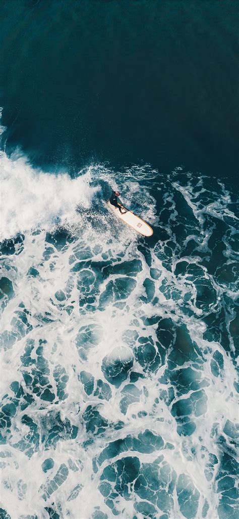 Person Surfing On Sea Waves During Daytime Iphone X Wallpapers Free