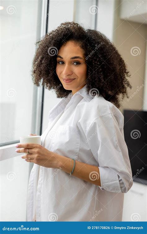 Pretty Curly Haired Woman In White Bathrobe In A Hotel In The Morning