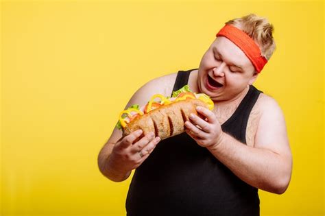 Premium Photo Fat Man Eating Fast Food Hamburger
