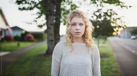 Pretty Teenage Girl Being Serious Outside In Nature Portrait By Stocksy Contributor Rob And