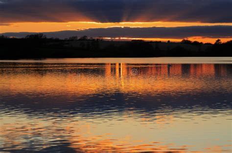 Clouds And Sunset Reflected In Still Water Stock Photo Image Of