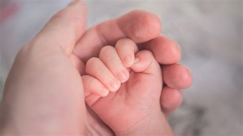 Mother Holds Infant Hand 4k 5k Hd Wallpapers Hd