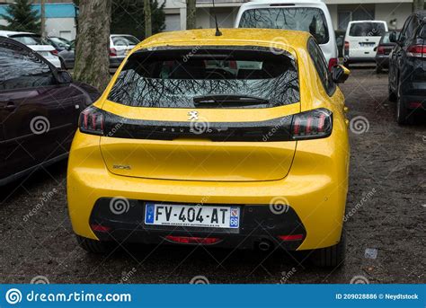 Rear View Of Yellow Peugeot 208 Gt Line Parked In The Street Editorial