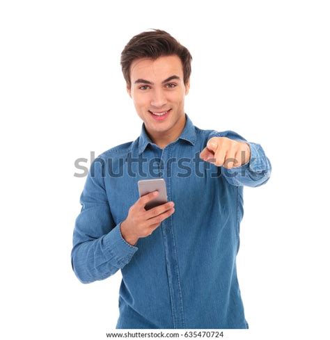 Young Casual Man Holding Phone Pointing Stock Photo 635470724