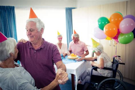 Group Of Seniors Celebrating A Birthday Stock Photo Image Of Elderly