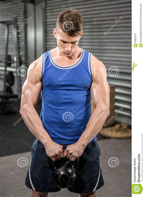 Muscular Man Lifting Heavy Kettlebell Stock Image Image Of Athlete