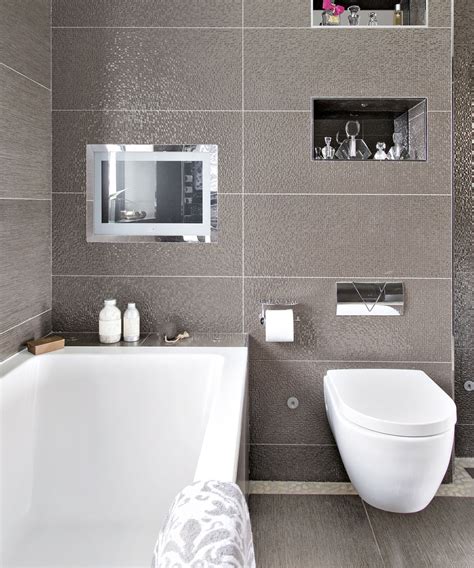 Narrow ensuites, like the one pictured above, work best with all sanitarywear positioned against the same. En-suite bathroom ideas | Ideal Home