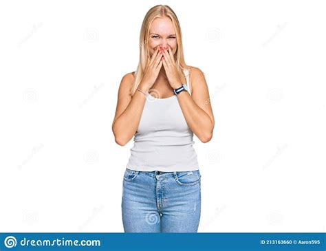 Young Blonde Girl Wearing Casual Style With Sleeveless Shirt Laughing And Embarrassed Giggle