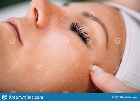 Face Lifting Massage Beautiful Woman Getting Face Lifting Massage In A Beauty Salon Stock Image