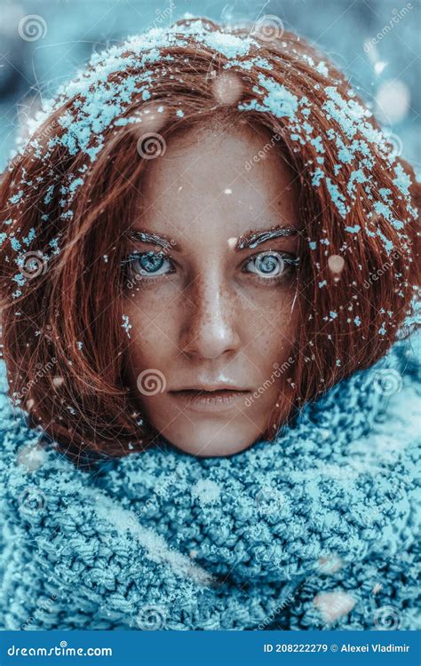 beautiful redhead woman in snow background portrait beauty portrait photoshoot stock image