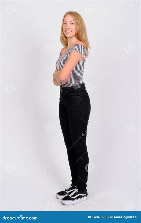 Full Body Shot Profile View Of Happy Young Beautiful Blonde Teenage