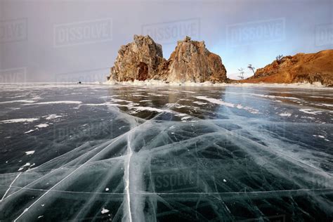 View Of Frozen Ice And Shamanka Rock On Burkhan Cape Baikal Lake