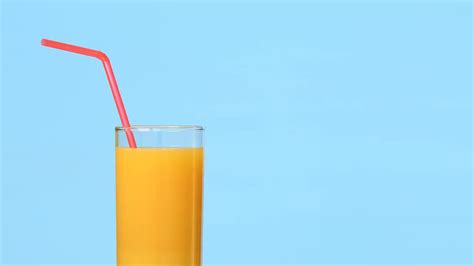 Orange Juice With Straw Stock Video Motion Array