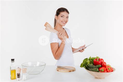Photo Of Cheerful Woman Cooking With Vegetables Isolated On White Background Royalty Free