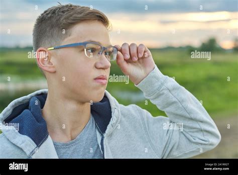 Close Up Outdoor Portrait Of Boy Of 14 Years Old With Glasses Teen