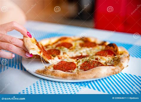 Hand Taking Pizza Slice Delicious Italian Pepperoni Or Salami Pizza