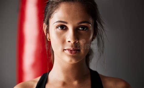 Fit Anf Confident Cropped Portrait Of An Attractive Young Female Boxer