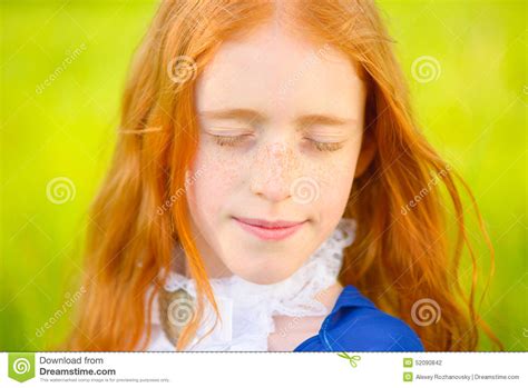 Red Haired Girl In A Sunny Garden Stock Photo Image Of Happiness