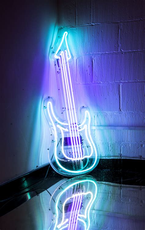 Neon Guitar Hire - Kemp London - Bespoke neon signs and prop hire.