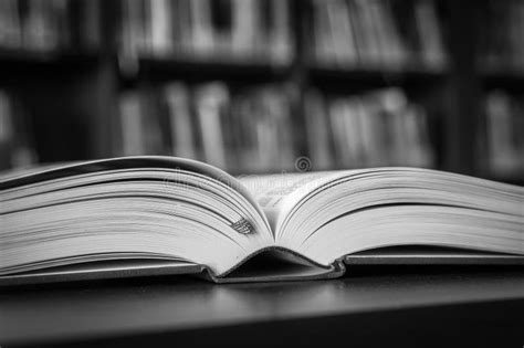 Black And White Open Book On The Table In A Library Stock Image Image