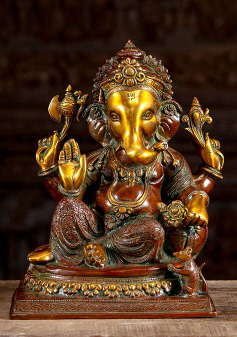 Brass Ganesh Statue Seated In Relaxed Posture Holding Lotus Flower With