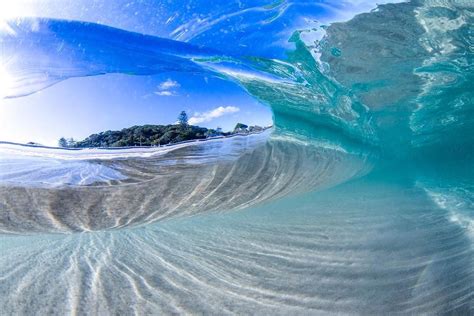 Stunning Shark Photography Shows Two Sharks Inside Of A Glassy Wave