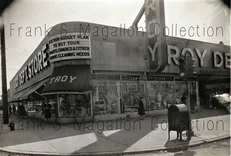 An Old Black And White Photo Of A Store Front