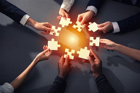 Teamwork Of Partners Concept Of Integration And Startup With Puzzle