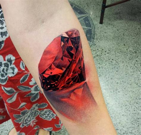 Realistic Red Jewel Tattoo On Arm Kelly Teske Goldsworthy Teske