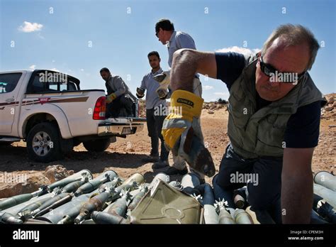International Bomb Disposal Members Prepare Demolition Of Unexploded
