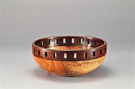 A Wooden Bowl Sitting On Top Of A Table