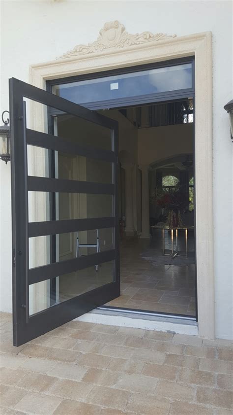 These doors offer a considerably larger surface area than you would get with a standard. SIW S-900 PIVOT DOOR | Florida Coastal Windows