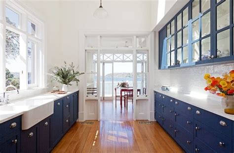 Kitchen or bathroom glass tile backsplash. Cobalt blue glass-front kitchen cabinets, marble ...