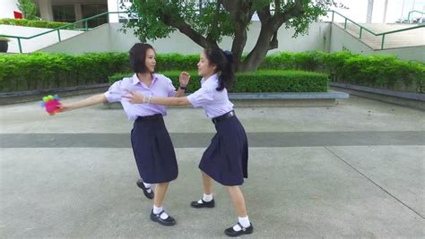 Cute Cheerful Asian Thai High Schoolgirls Student Couple