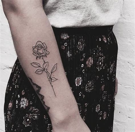 Simple Black Outline Rose Tattoo On The Forearm