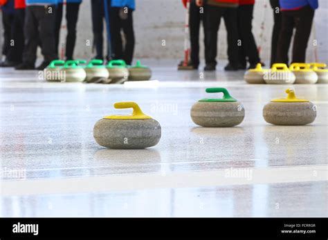 Curling Stones Standing Still On The Ice During A Game Stock Photo Alamy