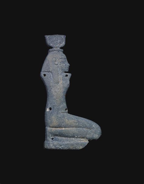 AN EGYPTIAN BLUE AMULET OF ISIS FROM A PECTORAL THIRD INTERMEDIATE