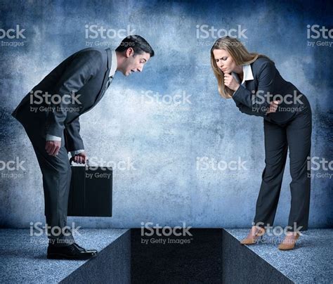 A Businessman Carrying A Briefcase And A Businesswoman With Her Hand