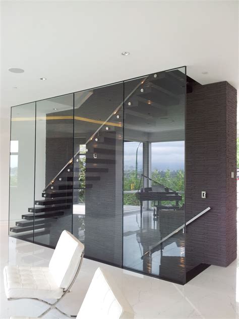 Glass Wall And Suspended Open Wood Stairs Stairway