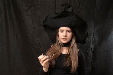 Premium Photo Portrait Of Young Girl In Pointed Witch Hat With