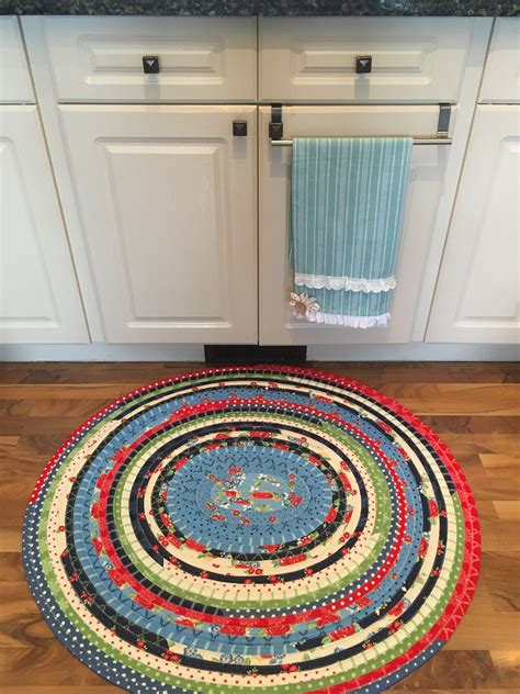 So, a braided rug or rug with themes such as strawberries or sunflowers will suit well that style. Hand-sewn Jelly Roll Rug. Vibrant country kitchen rug with ...