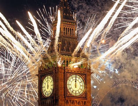 London At 0000 The Big Ben And The London Eye Change To Firework