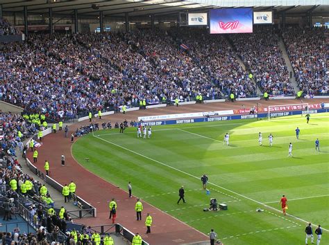 With a capacity of 51,866, the site serves as the national football stadium in scotland. Hampden Park, Glasgow | Rangers players (in white ...