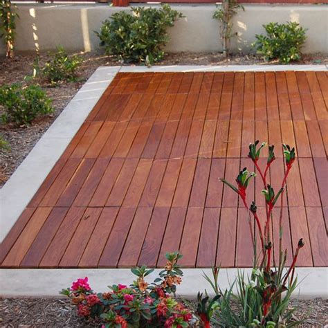 The interlocking plastic base makes them very easy to apply and no tools required. Curupay, Outdoor, Wood, Deck, Tiles - HomeInfatuation.com.