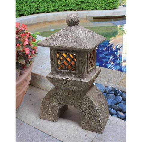 Imagine the classic lines of these asianimagine the classic lines of these asian influenced sculptures set amidst your flowerbed or near your pool or pond. Japanese Pagoda Solar Lantern Home Decor Statues ...