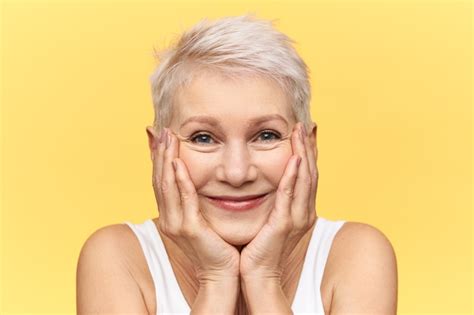 Free Photo Studio Shot Of Cute Funny Middle Aged Female With Dyed