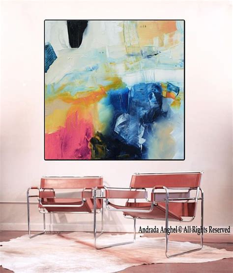 An Abstract Painting Hangs On The Wall Above Two Chairs In Front Of A