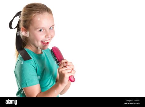 Girl Singing Into Hairbrush Cut Out Stock Images And Pictures Alamy