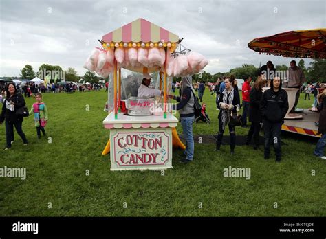 Woman Buying Cotton Candy From Vendor At Cheam Village Fair Surrey