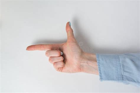 Female Hand Shows The Direction Of Index Finger Pointing Hand On White